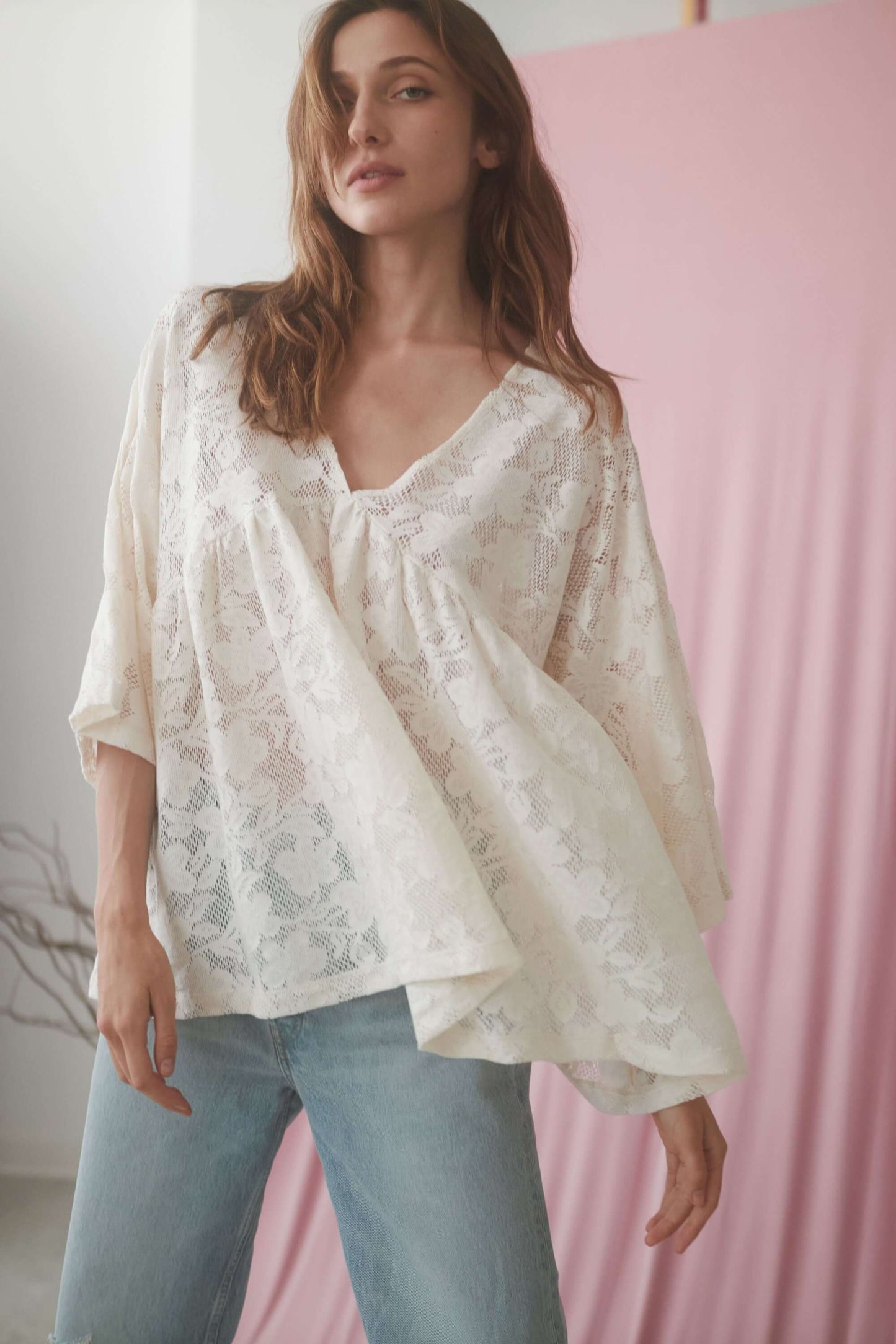 Ecru lace boho tunic top with V-neck and wide sleeves, showcasing a relaxed silhouette and made from organic cotton.