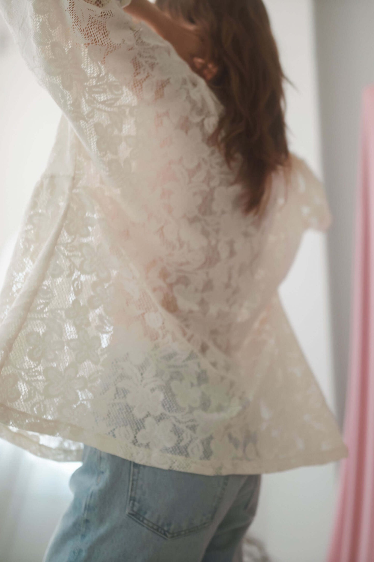 Lace boho tunic top in ecru, featuring a V-neckline and wide short sleeves, styled with casual denim.