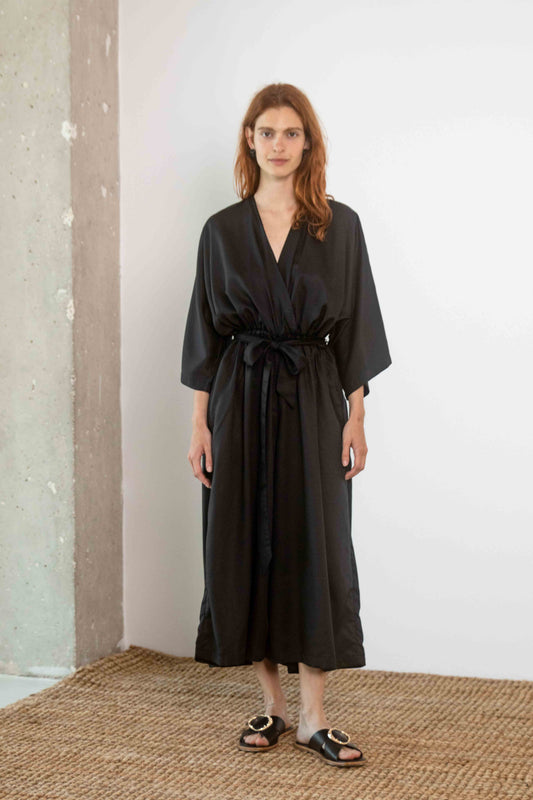 Tencel Kimono Jumpsuit in Black worn by model, featuring relaxed silhouette and culotte-style trousers.