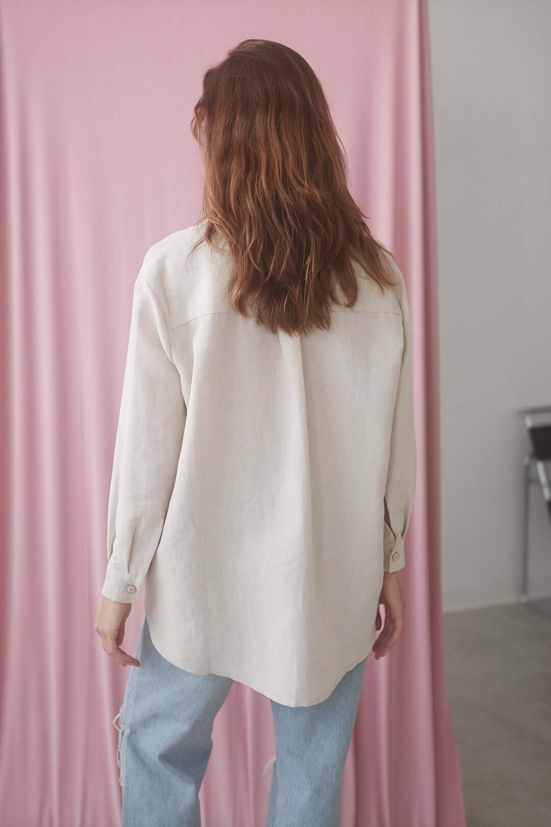 Natural wide shirt featuring oversized fit, eco buttons, and crafted from organic cotton-linen blend, styled with jeans.