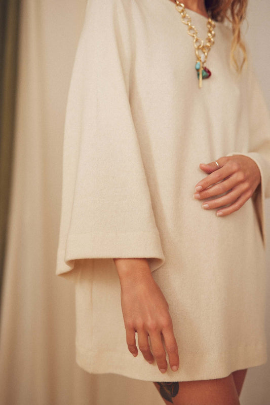 Oat Fine Knit Mini Dress with flared sleeves, perfect for autumn layering and evening wear.