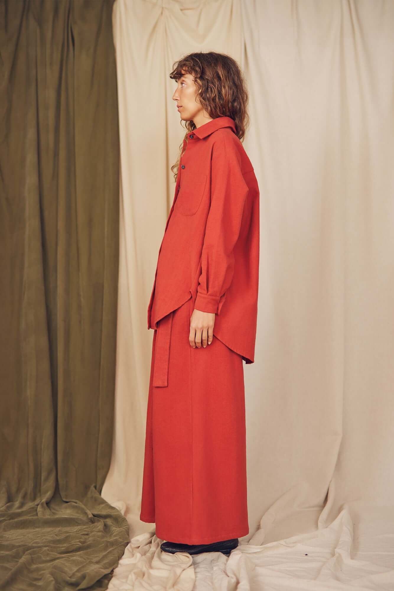 Model showcasing the Rust Organic Cotton Wide Overshirt, highlighting its oversized silhouette and eco-friendly design.