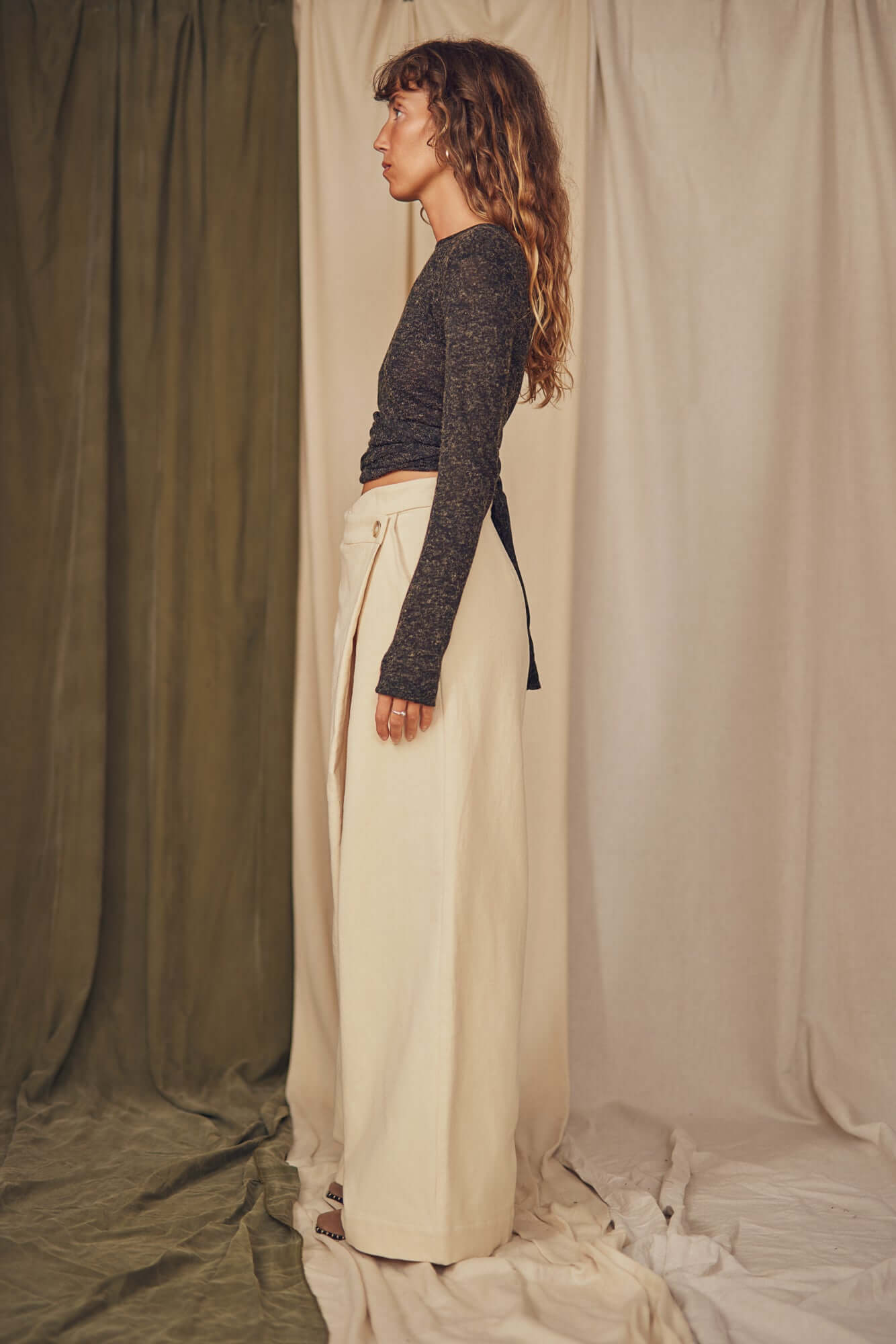 Woman wearing oat wrap trousers.