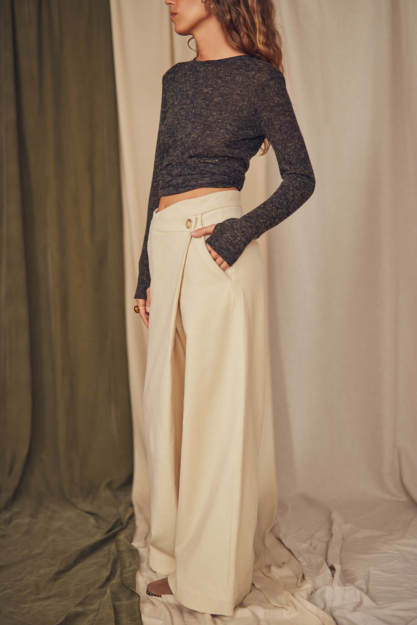 Woman wearing oat wrap trousers.