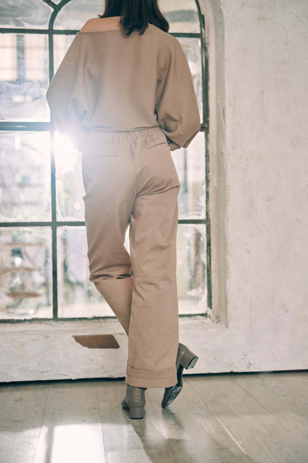 Taupe Trousers - ARCHIVE SALE worn by a model in a stylish setting, showcasing the organic cotton fabric.