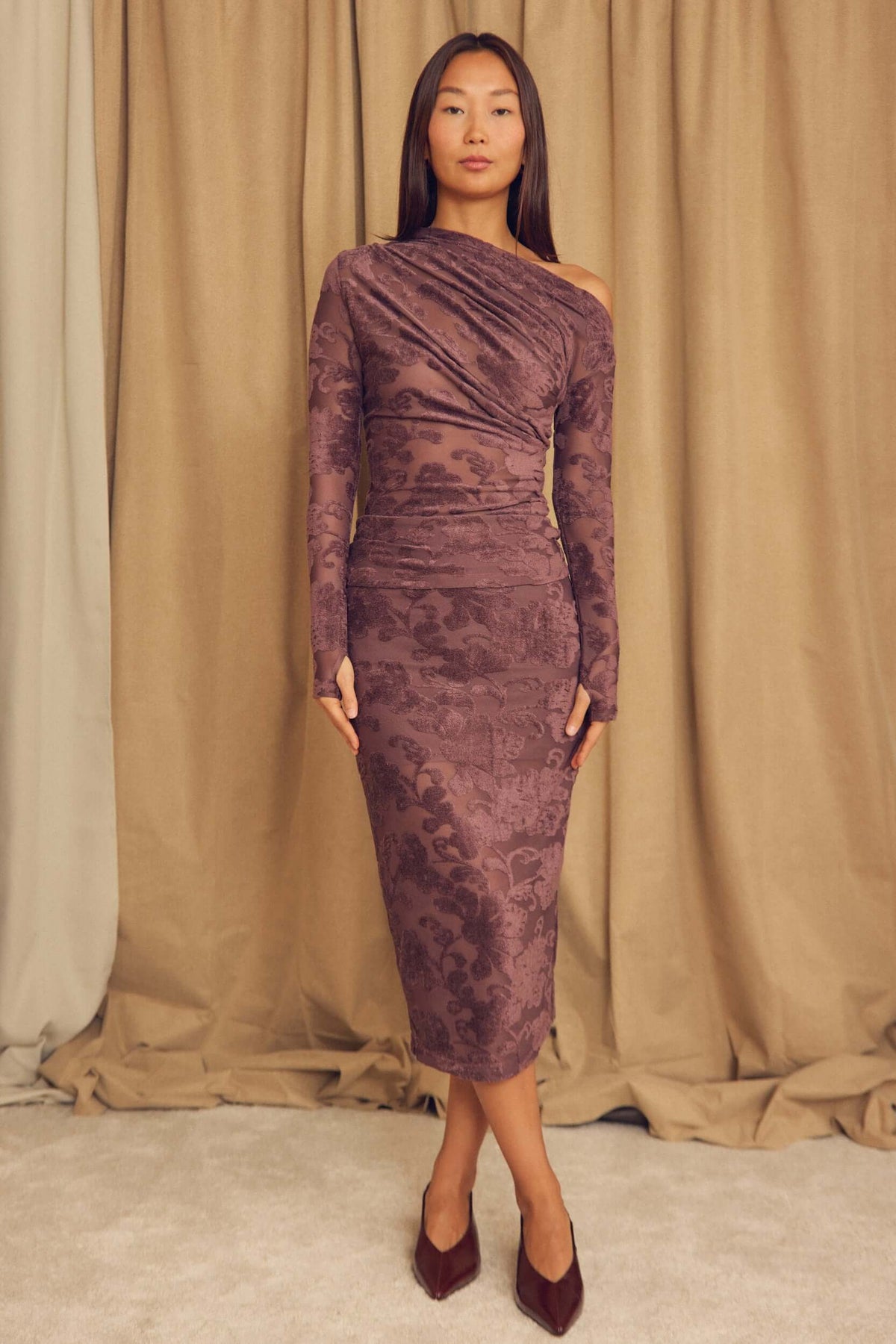 Model wearing Cocoa Devoré Fitted Midi Skirt with an abstract pattern in a stylish pose.