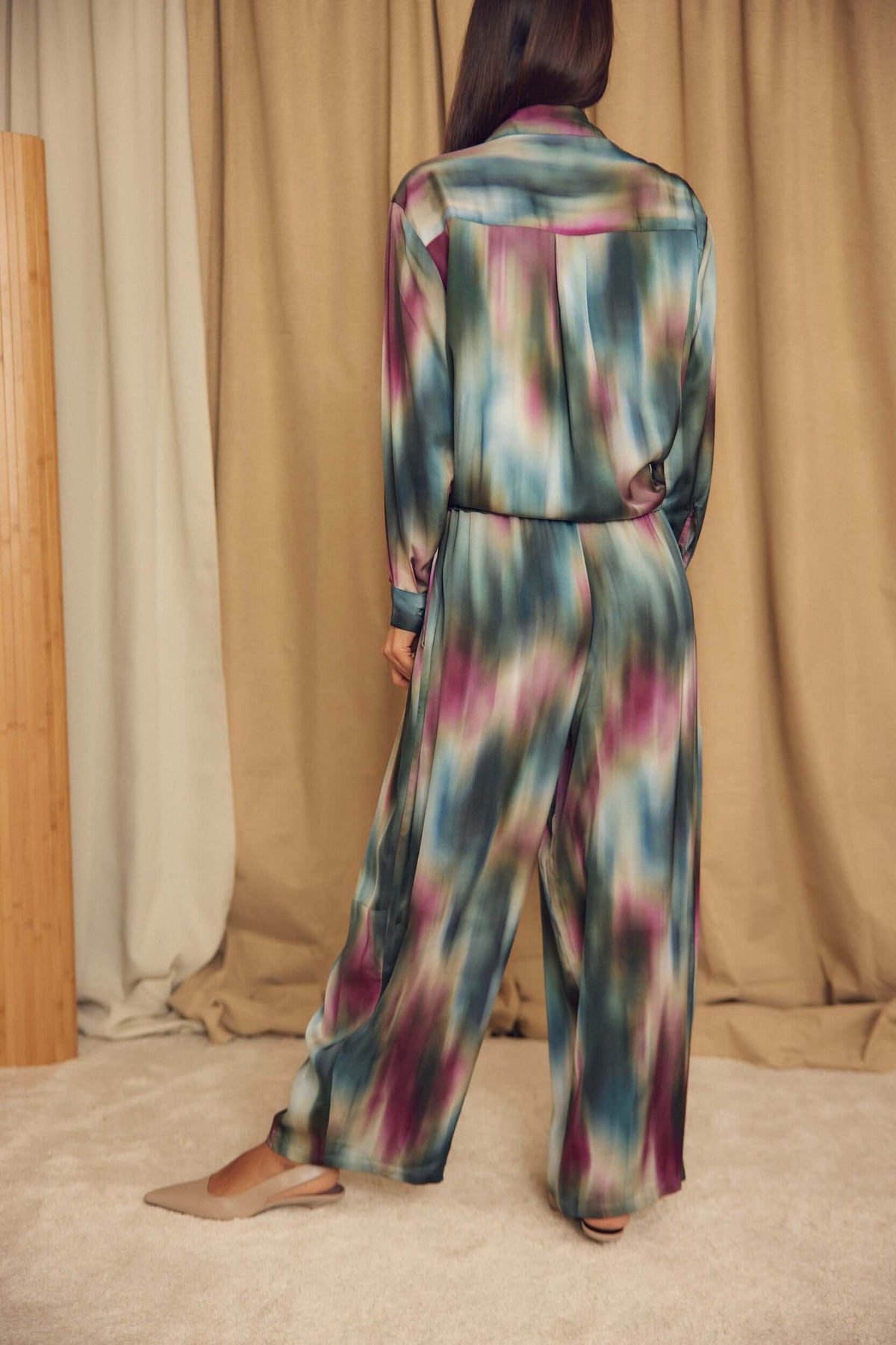 Model wearing Printed ECOVERO Viscose Barrel-Leg Trousers with an artistic print, showcasing the relaxed silhouette.