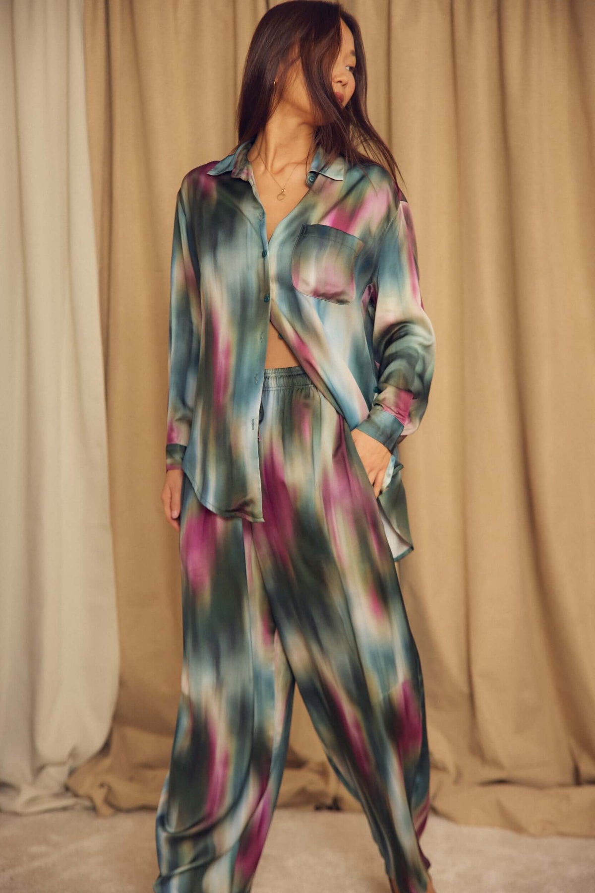 Model wearing a Printed ECOVERO Viscose Oversized Shirt with colorful patterns and relaxed fit, showcasing autumn style.