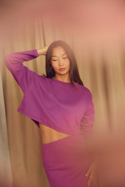 Plum Organic Cotton Oversized Crop Top worn by a model, showcasing its relaxed silhouette and contemporary design.