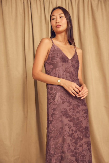 Model wearing Cocoa Devoré Strappy Midi Slip Dress with delicate straps and abstract devoré pattern.