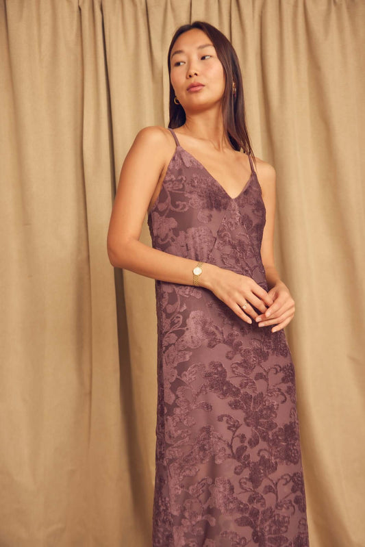 Model wearing Cocoa Devoré Strappy Midi Slip Dress with delicate straps and abstract devoré pattern.