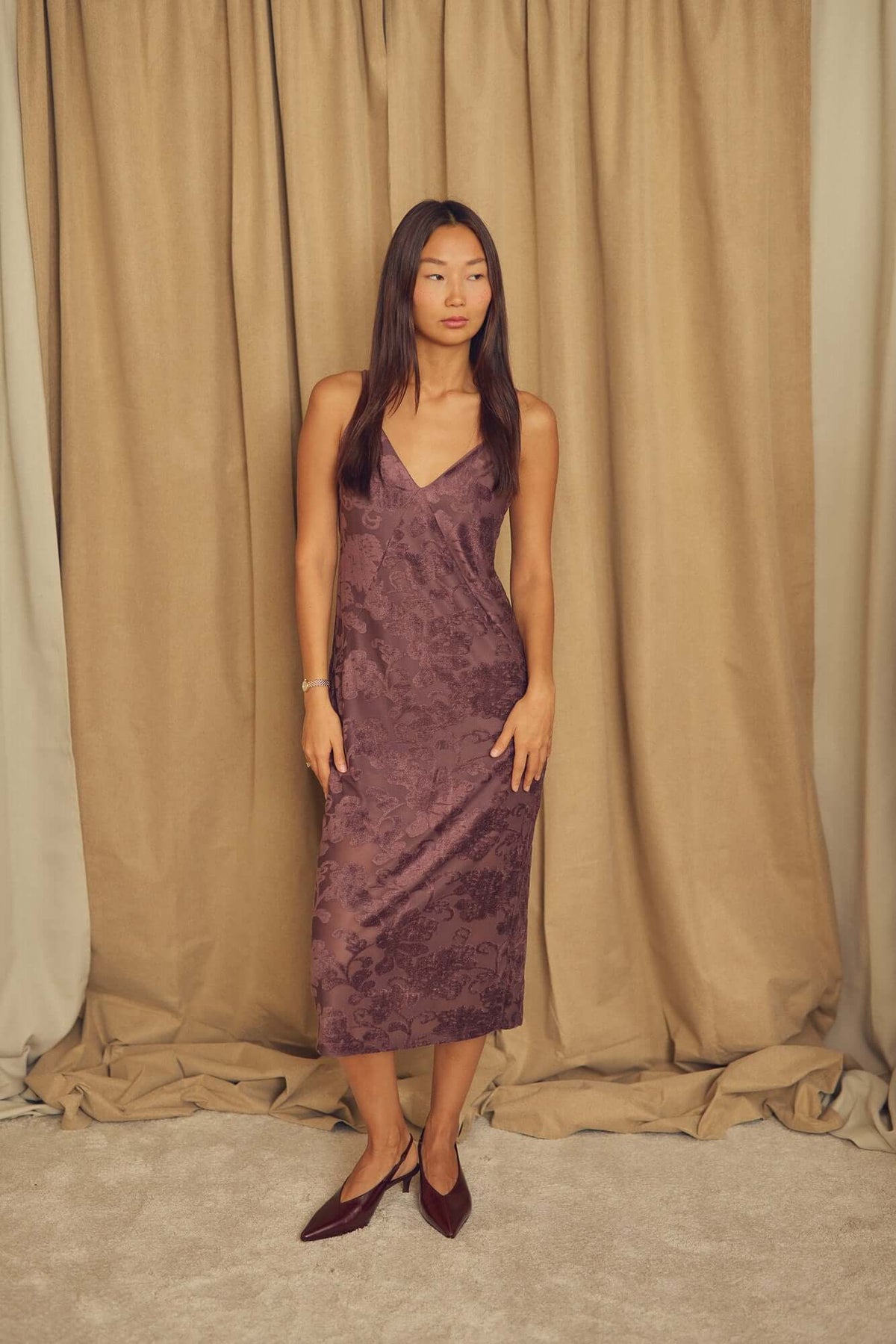 Cocoa Devoré Strappy Midi Slip Dress displayed by a model against a neutral backdrop, showcasing its elegant silhouette and design.