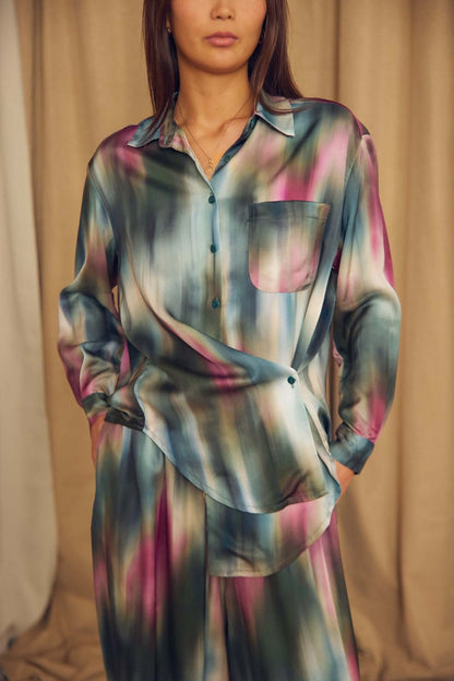 Model wearing a Printed ECOVERO Viscose Oversized Shirt in colorful pattern, showcasing its relaxed fit and elegant design.