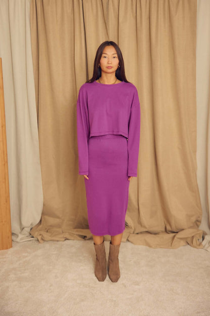 Model wearing a Plum Organic Cotton Oversized Crop Top with a matching skirt in a studio setting.