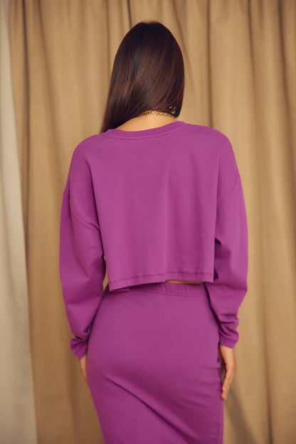 Plum Organic Cotton Oversized Crop Top displayed back view on model with long sleeves and cropped design.