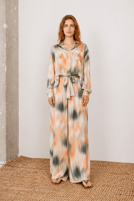 Printed Cropped Ecovero Viscose Oversized Shirt worn by a model in a modern setting.