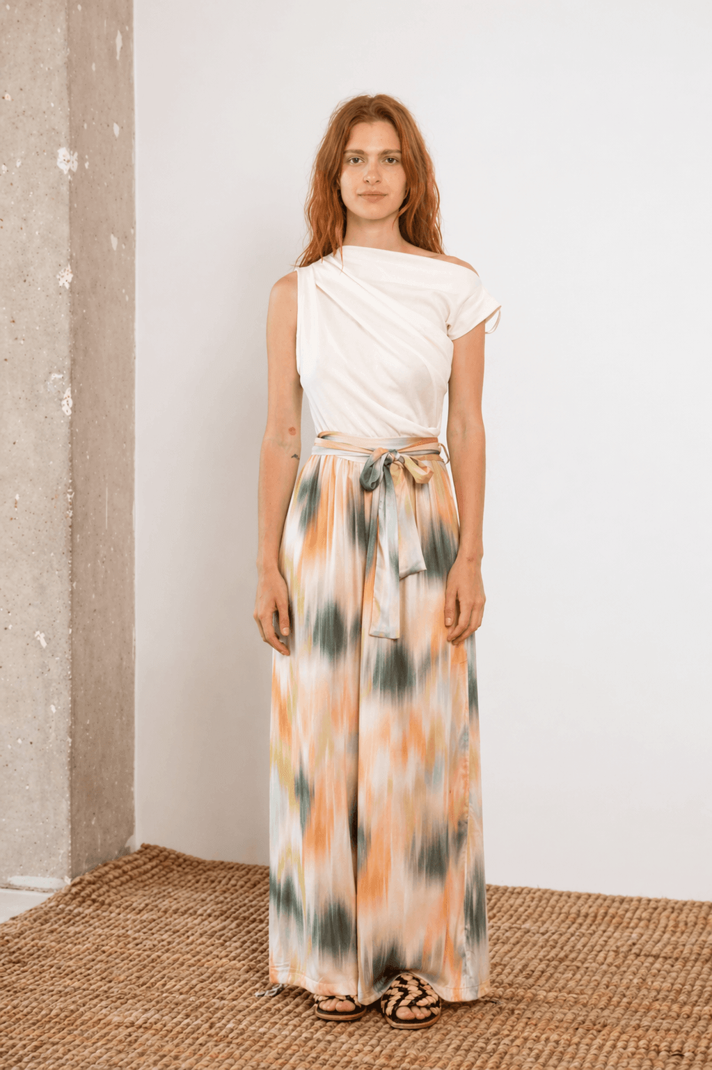 Banana Pineapple Drape Neckline Bodysuit in Ecru styled with a flowy patterned skirt, perfect for casual chic outfits.