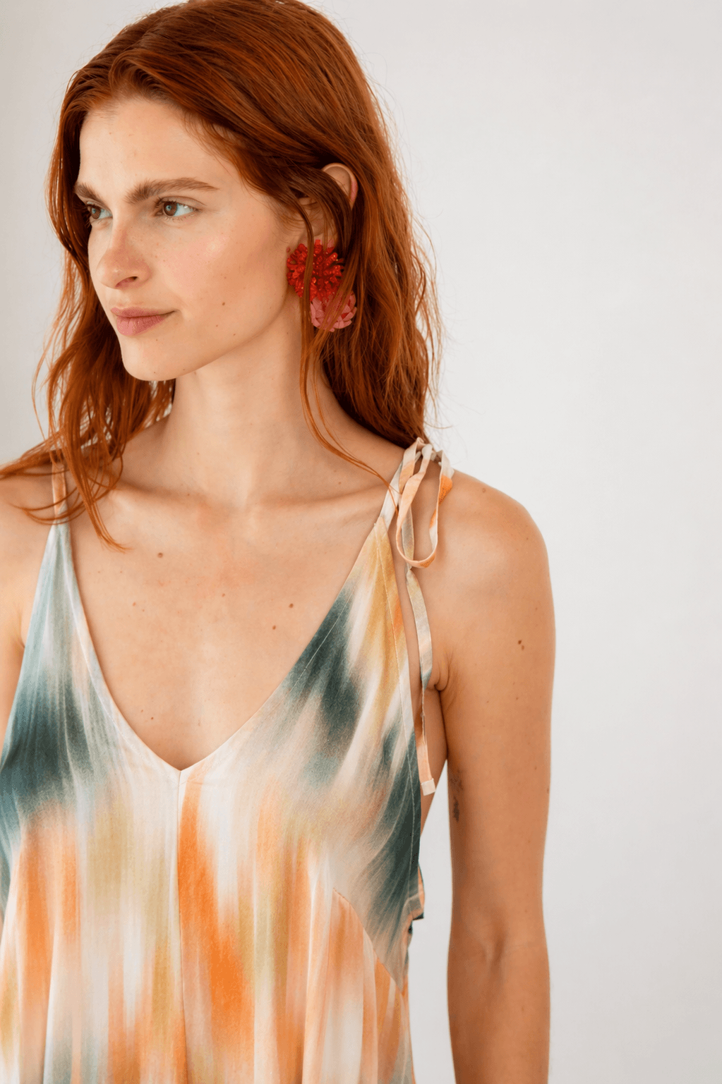Model wearing a Printed Ecovero Viscose Maxi Dress with a colorful design and adjustable shoulder straps.