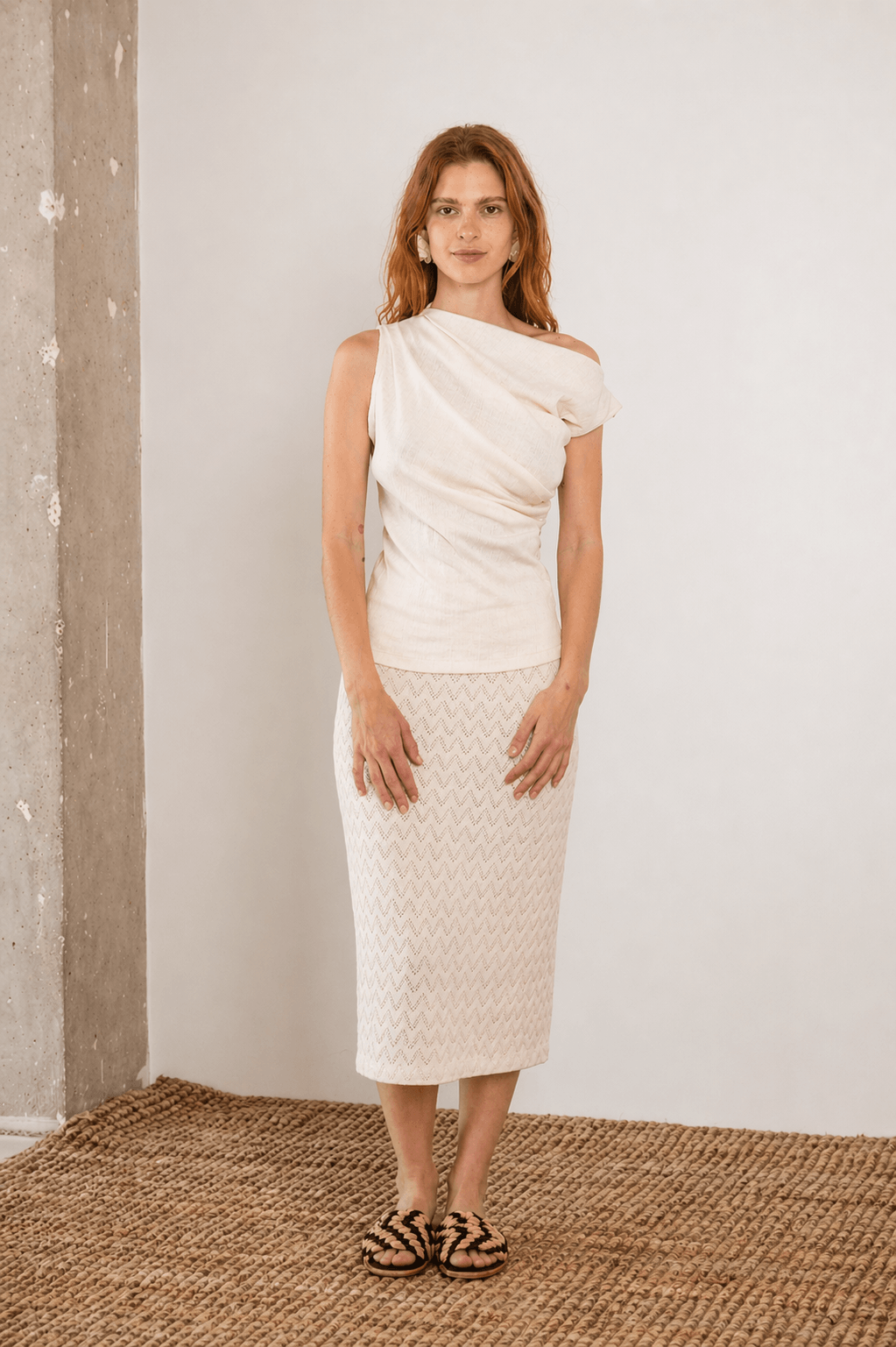 Model wearing a Banana Pineapple Drape Neckline Top in Ecru, showcasing its elegant draped design and textured fabric.