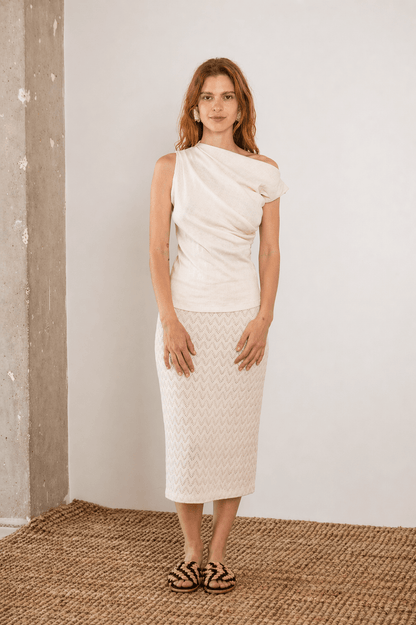 Model wearing a Banana Pineapple Drape Neckline Top in Ecru, showcasing its elegant draped design and textured fabric.
