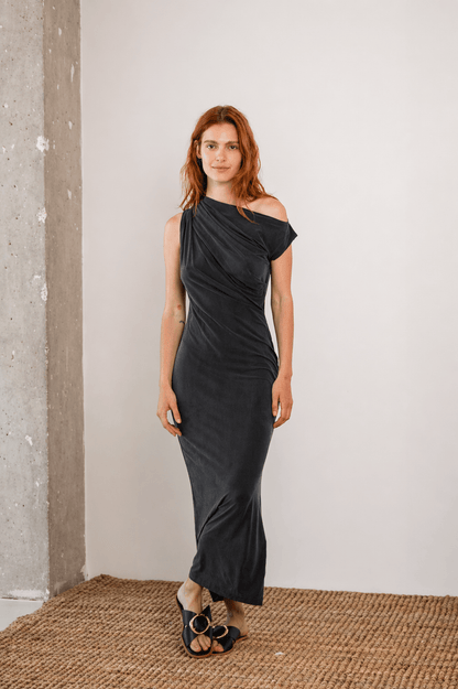 Drape Cupro Midi Dress in Slate Black displayed on a model, showcasing its soft structure and stylish draped neckline.