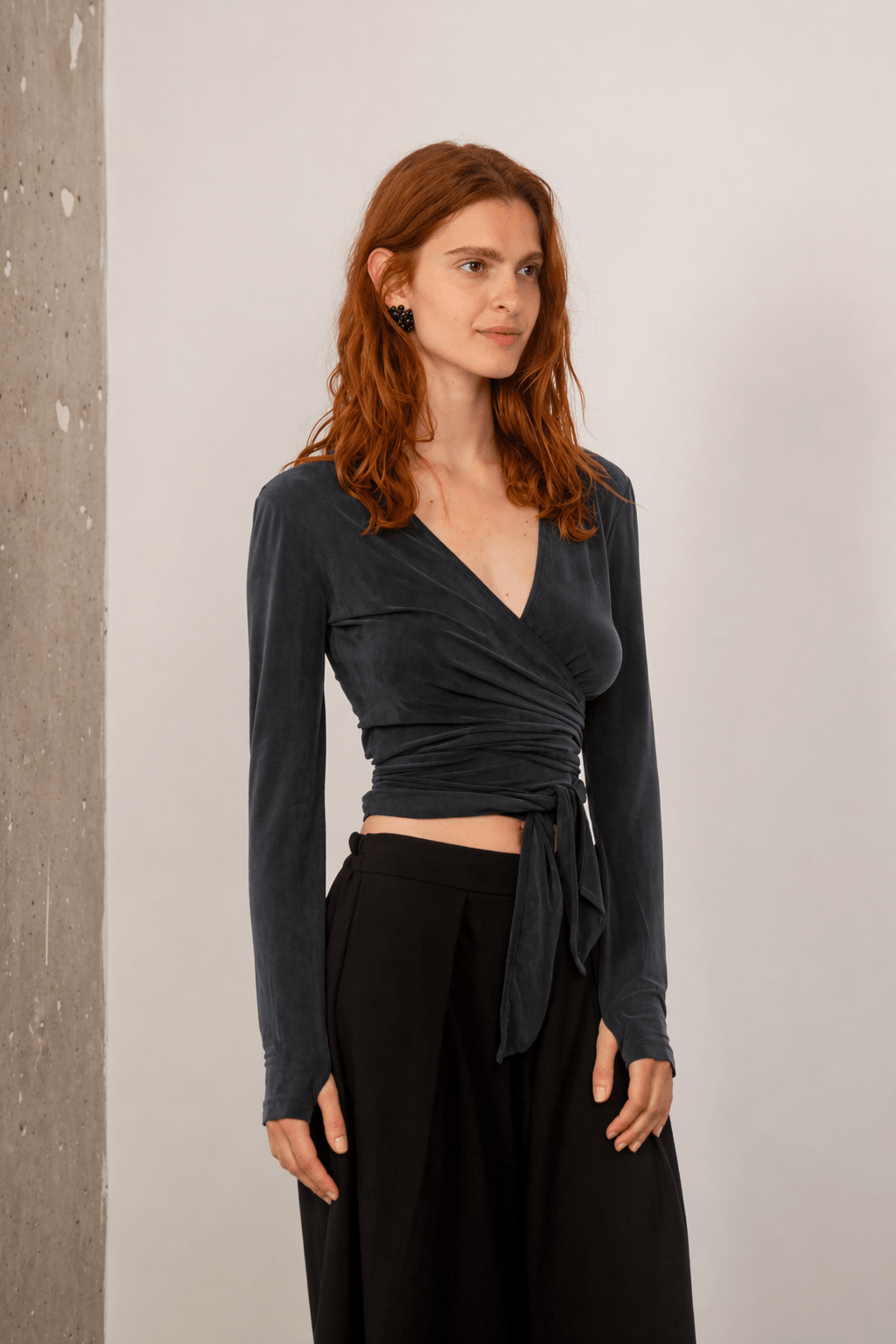 Cupro Multiway Wrap Top in Slate Black showcased on a model, featuring a stylish wrap design.