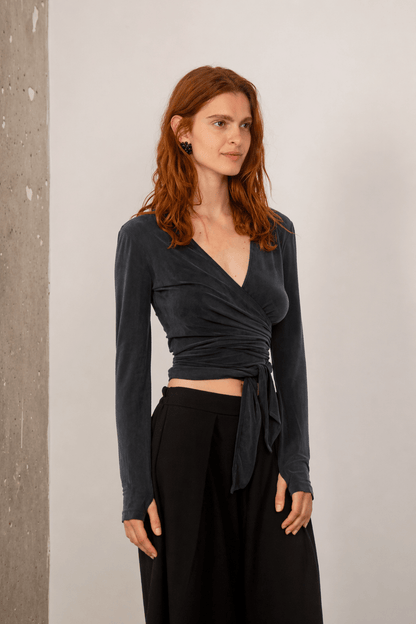 Cupro Multiway Wrap Top in Slate Black showcased on a model, featuring a stylish wrap design.