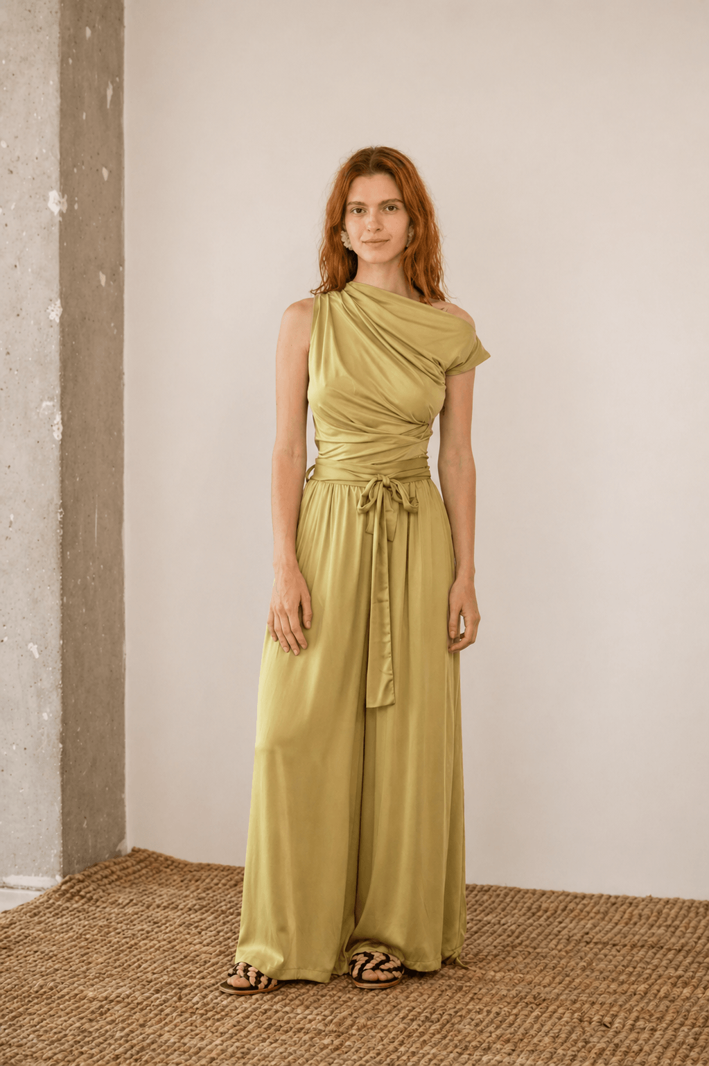 Wide Ecovero Trousers in Soft Olive model showcasing elegant style and breathable fabric in a relaxed fit.