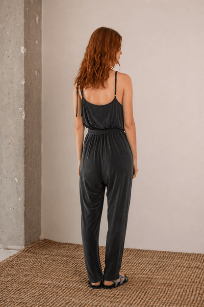 Cupro Slip Jumpsuit with Belt in Slate Black, showcasing the back view and relaxed fit.