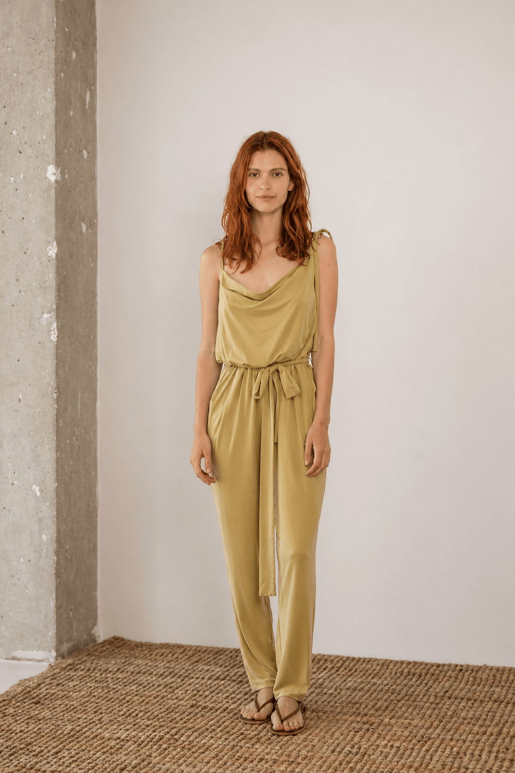 Cupro Slip Jumpsuit with Belt in Olive, showcasing relaxed elegance and versatility in soft jersey cupro.