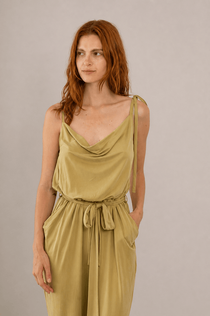 Cupro Slip Jumpsuit with Belt in Olive worn by model, showcasing elegant drape and slim straps.