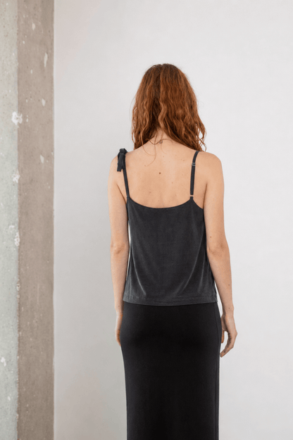 Cupro Drape Slip Top in Soft Olive showcasing adjustable straps and a fluid fit from the back view.