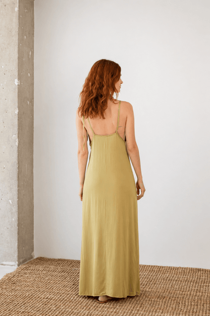 Ecovero Maxi Dress in Soft Olive showcasing the back design and adjustable straps, perfect for Spring–Summer 2026.