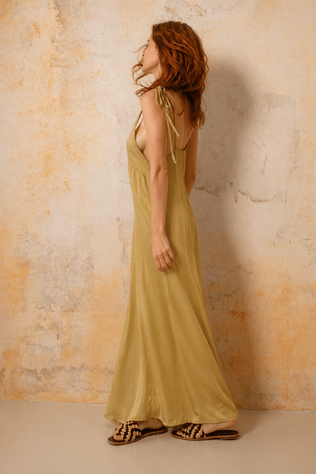 Ecovero Maxi Dress in Soft Olive worn by model, showcasing its fluid silhouette and adjustable shoulder straps.