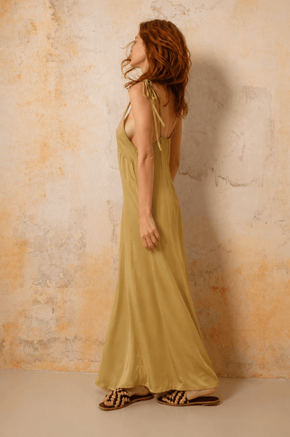 Ecovero Maxi Dress in Soft Olive worn by model, showcasing its fluid silhouette and adjustable shoulder straps.
