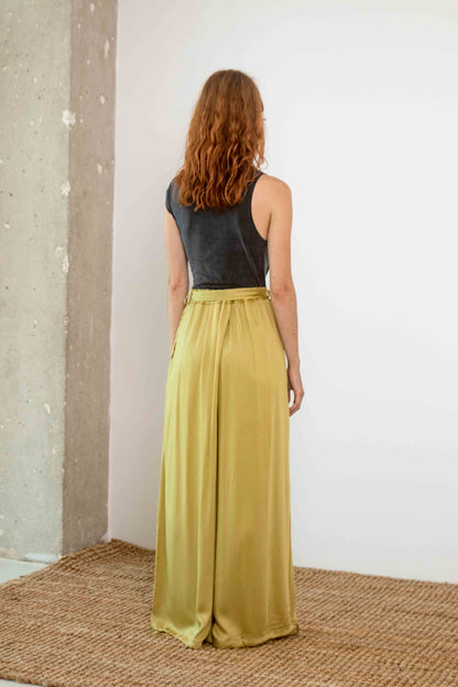 Wide Ecovero Trousers in Soft Olive showcased from the back, featuring a relaxed fit and silky drape.