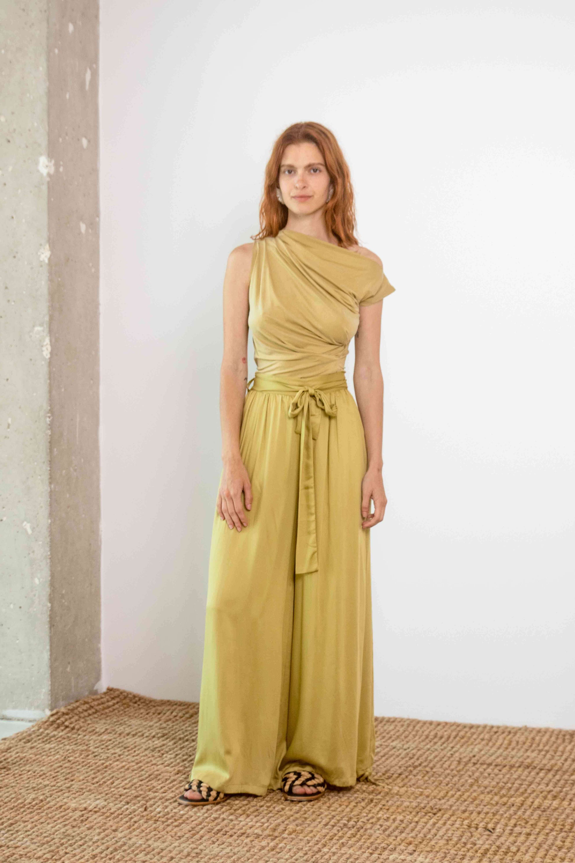 Drape Neckline Cupro Top in Soft Olive worn with a matching flowy skirt, showcasing elegant spring-summer style.