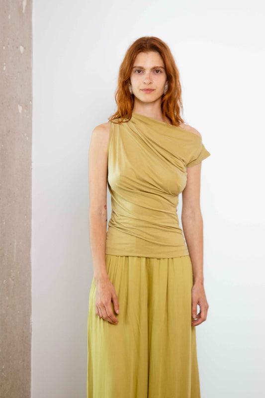 Drape Neckline Cupro Top in Soft Olive worn by a model, showcasing elegant draped design and soft jersey material.