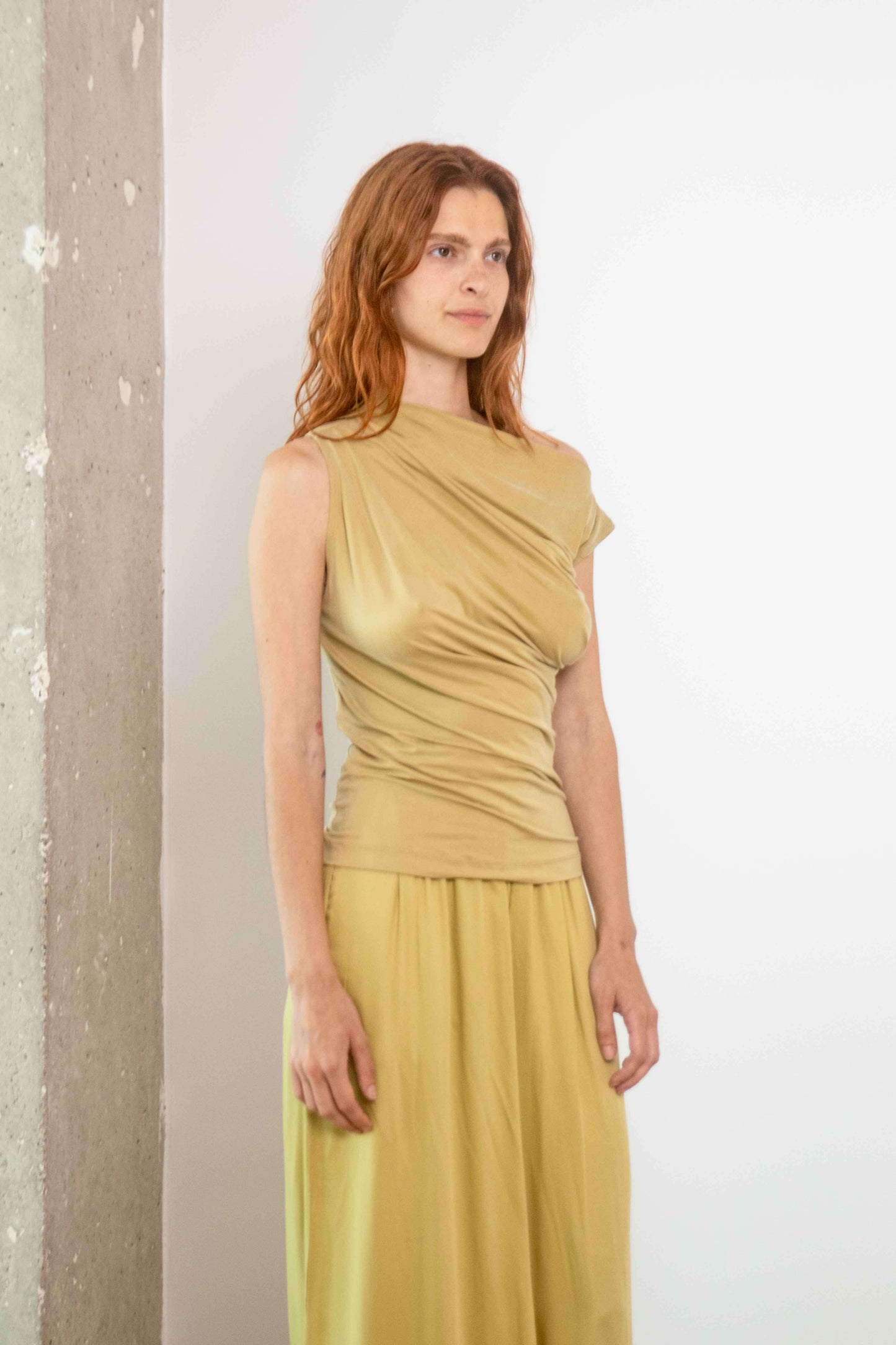 Drape Neckline Cupro Top in Soft Olive displayed on model, showcasing its refined design and elegant fit.