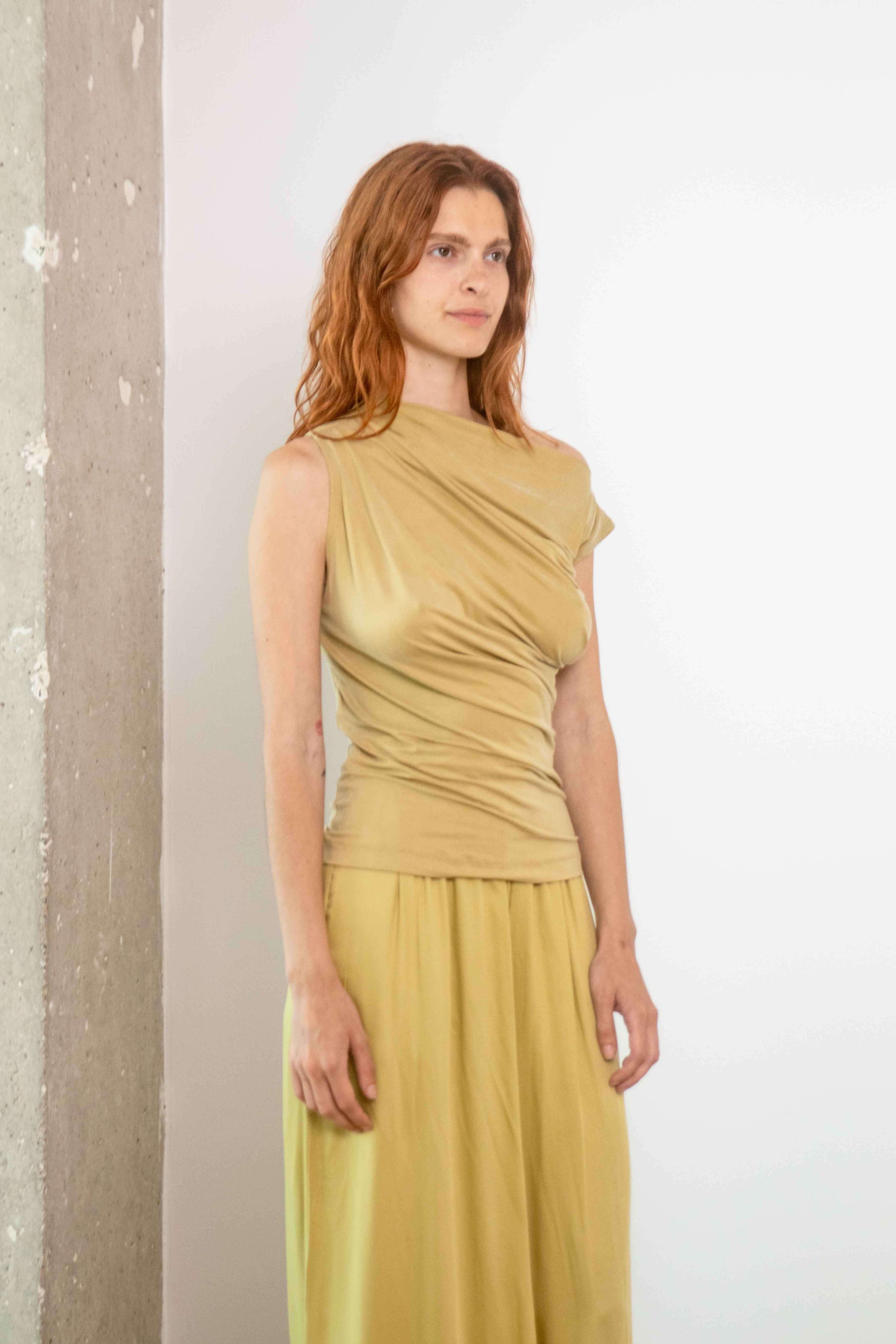 Drape Neckline Cupro Top in Soft Olive displayed on model, showcasing its refined design and elegant fit.