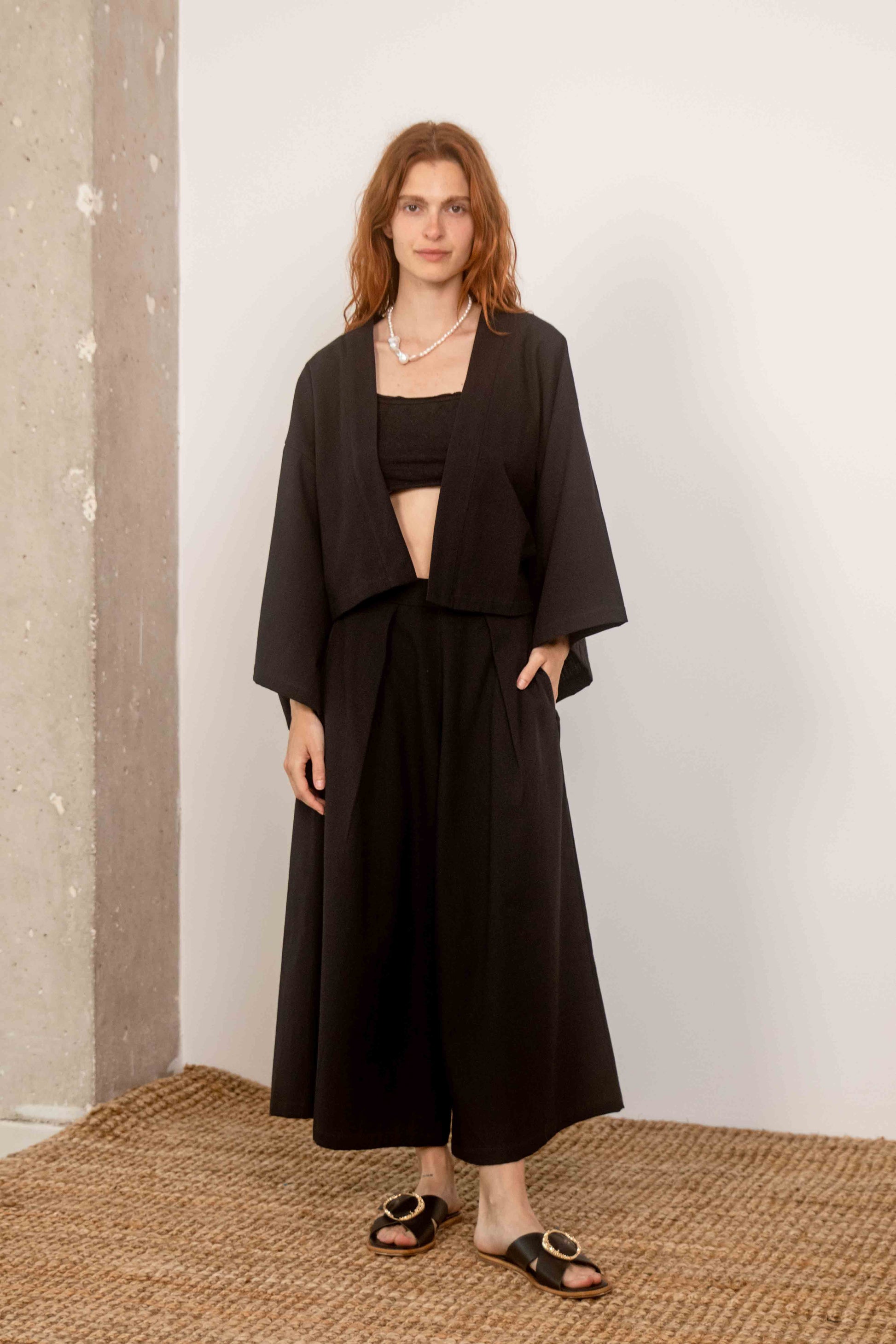 Organic Cotton Wide Culottes in Black, model wearing cropped top and kimono-style jacket, showcasing modern summer style.