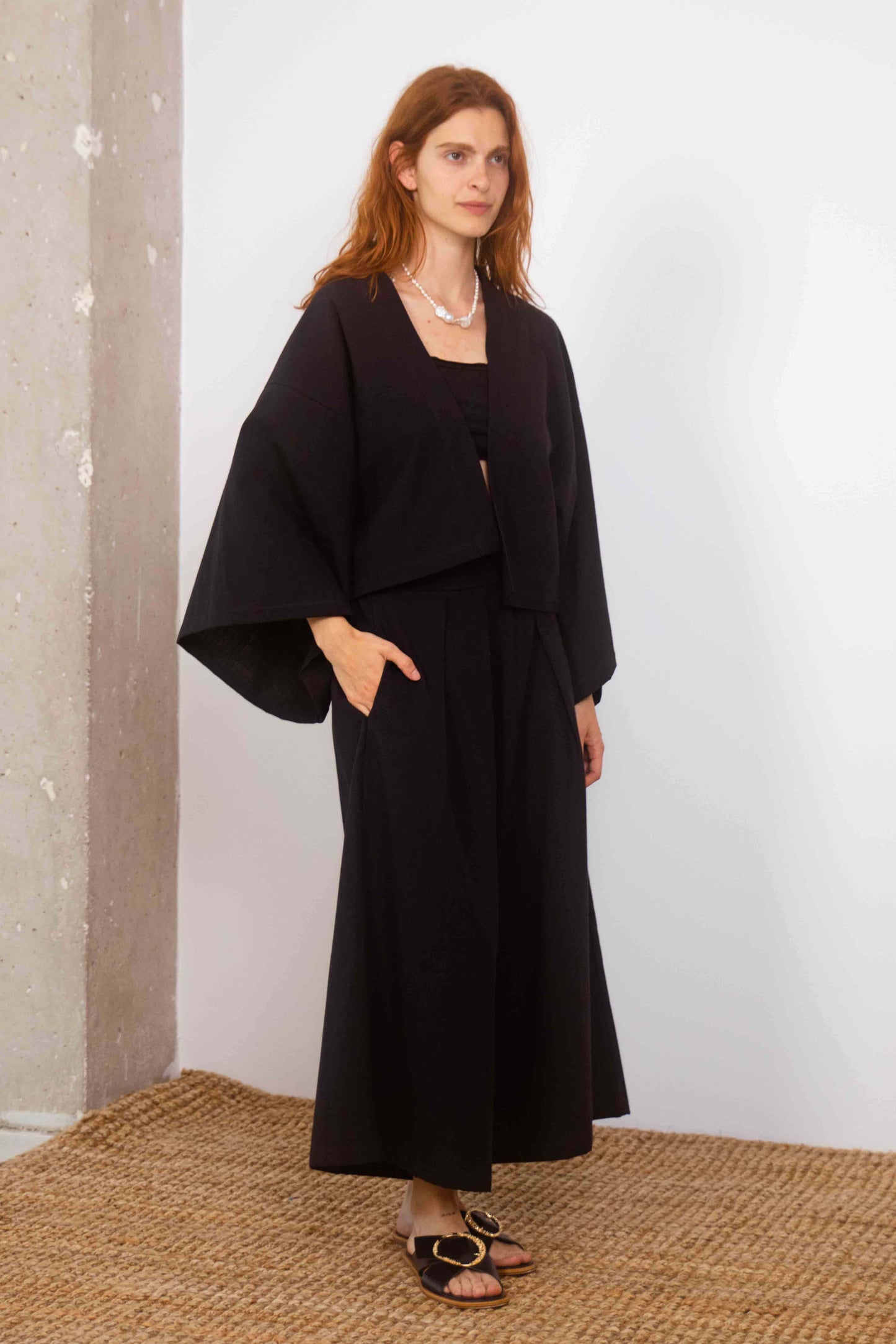 Organic Cotton Wide Culottes in Black worn by model, showcasing oversized, cropped silhouette and stylish comfort.