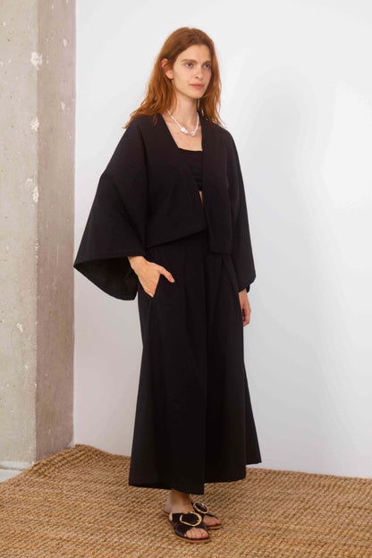Organic Cotton Wide Culottes in Black worn by model, showcasing oversized, cropped silhouette and stylish comfort.