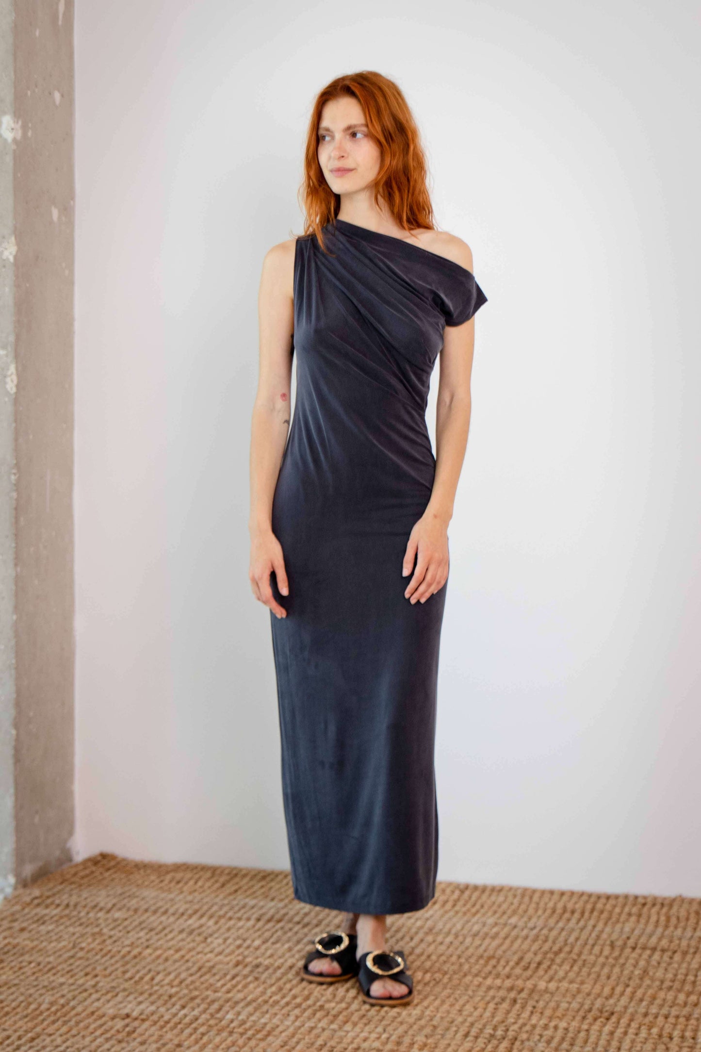 Drape Cupro Midi Dress in Slate Black worn by model against a neutral background.