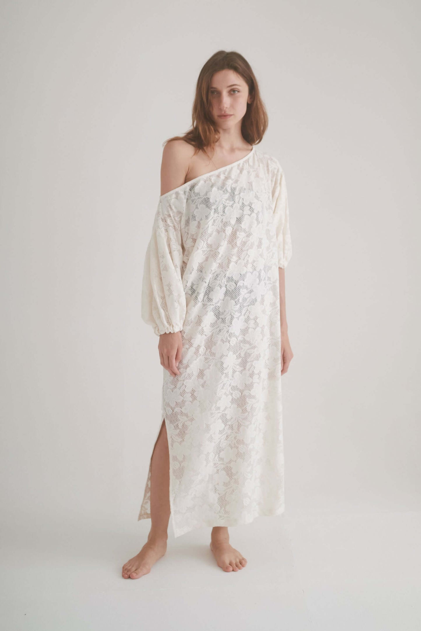 Elegant ecru lace boho maxi dress with balloon sleeves and side slit, made from 100% organic cotton.