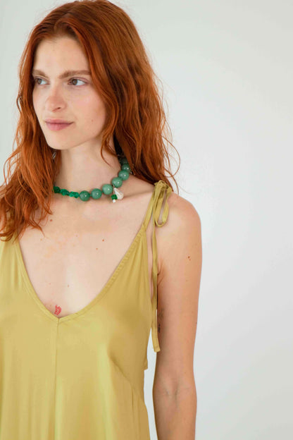 Ecovero Maxi Dress worn by a model with red hair and green necklace.