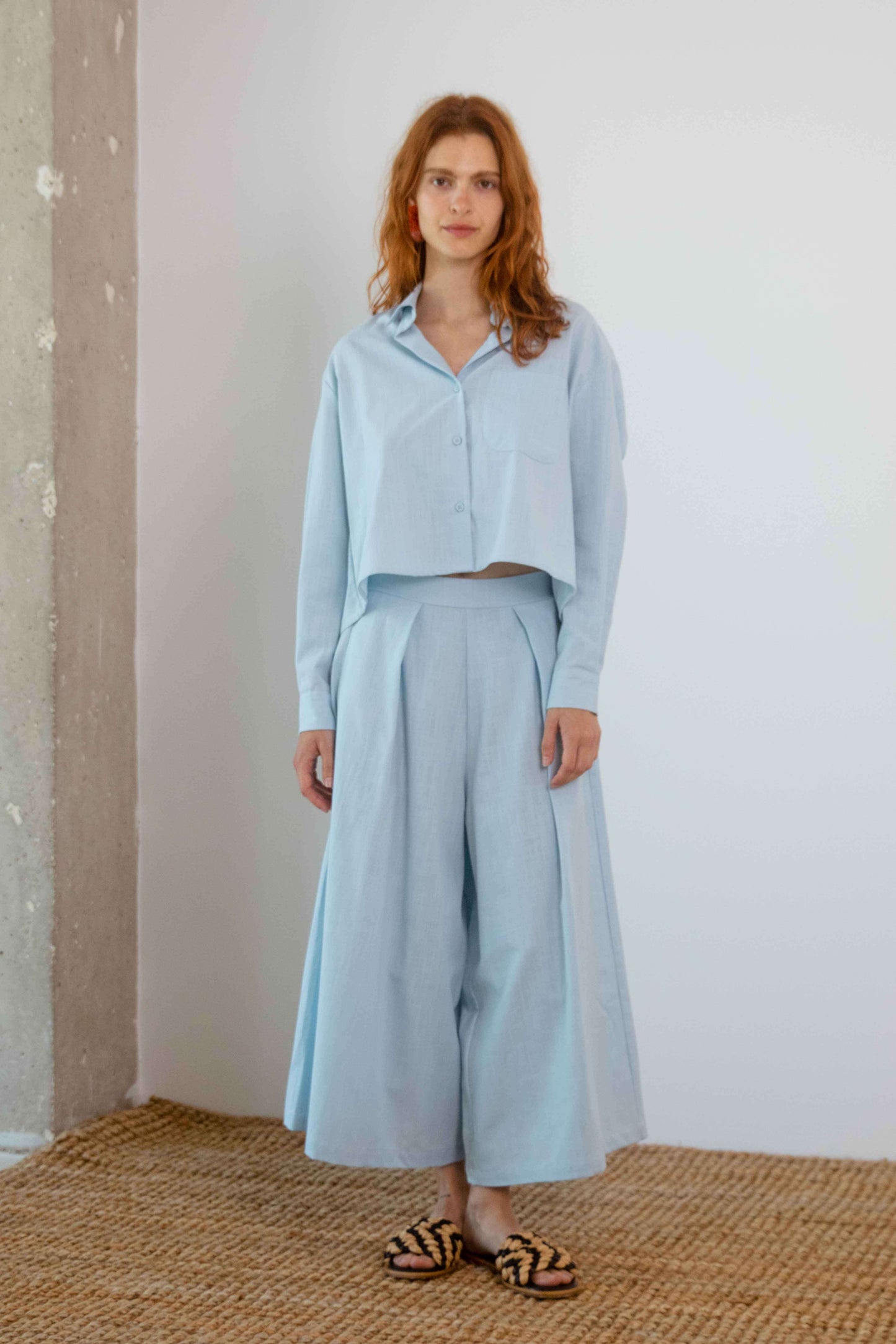 Organic Cotton Wide Culottes in Pale Blue worn with matching shirt for a stylish spring-summer look.