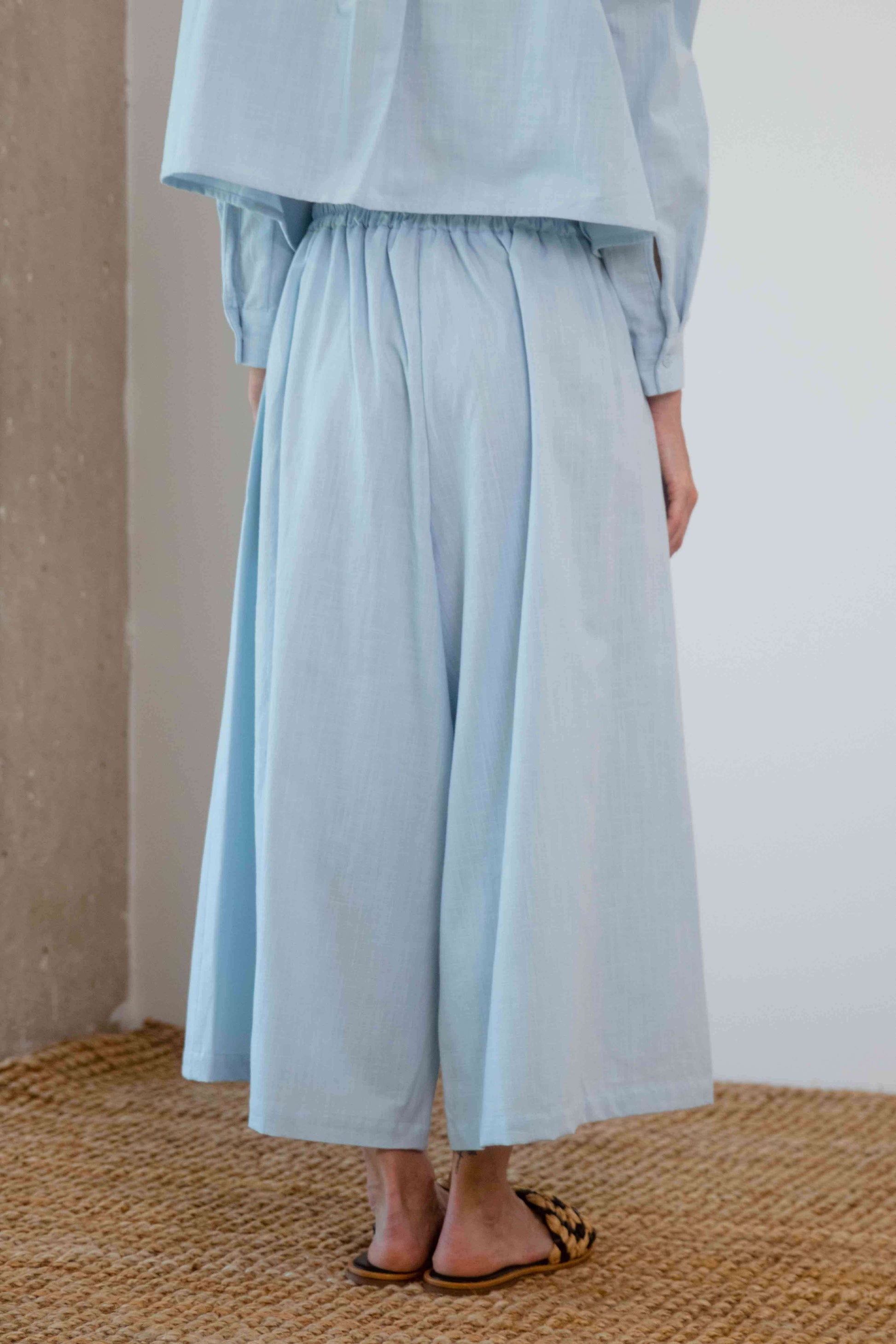 Organic Cotton Wide Culottes in Pale Blue, showcasing the back view and relaxed silhouette in a soft, breathable fabric.