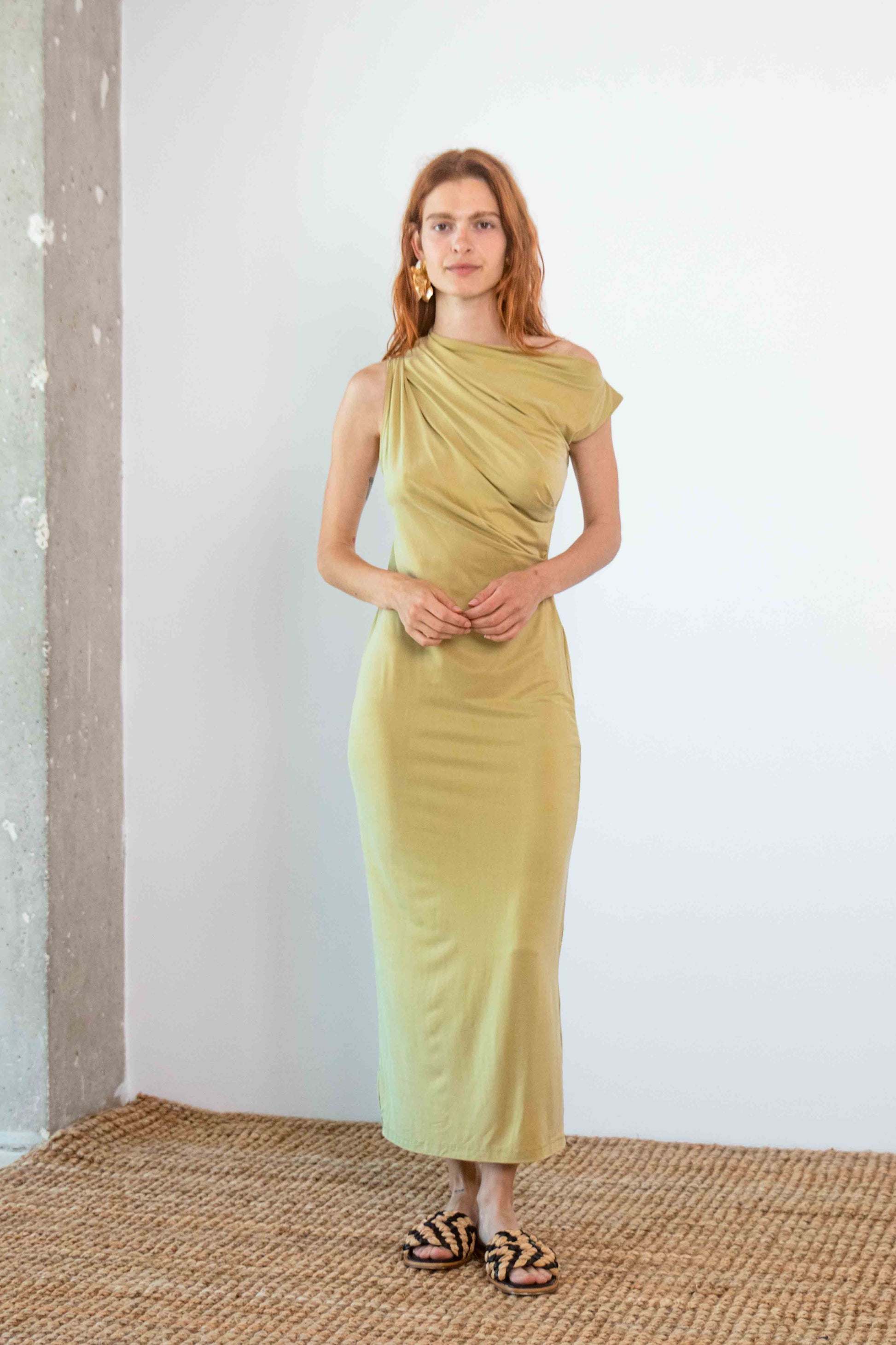 Drape Cupro Midi Dress in Olive showcased on a model with a soft draped design and elegant silhouette.