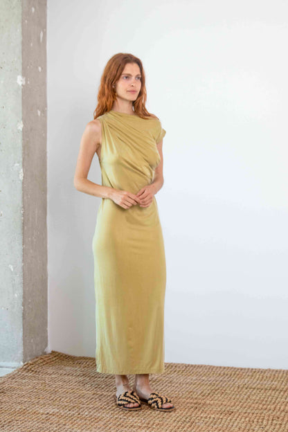 Drape Cupro Midi Dress in Olive worn by a model, showcasing its elegant draped design and smooth fabric.